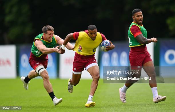 Anthony Watson of England takes on Tom Curry of England during a training session at Pennyhill Park on July 18, 2023 in Bagshot, England.