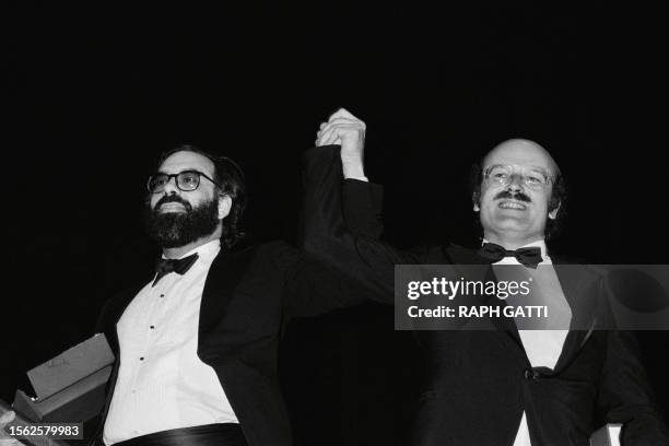 Film director Francis Ford Coppola and German Volker Schloendorff pose on May 24, 1979 after being awarded with the Palme d'Or for their films...
