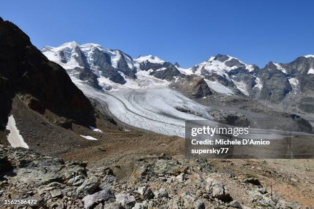 the mighty but receding morteratsch glacier, under its summits - summer of 77 stock pictures, royalty-free photos & images