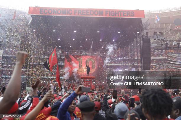 Economic Freedom Fighters leader Julius Malema gestures from the stage as he celebrates the 10th anniversary of the party with his supporters at the...