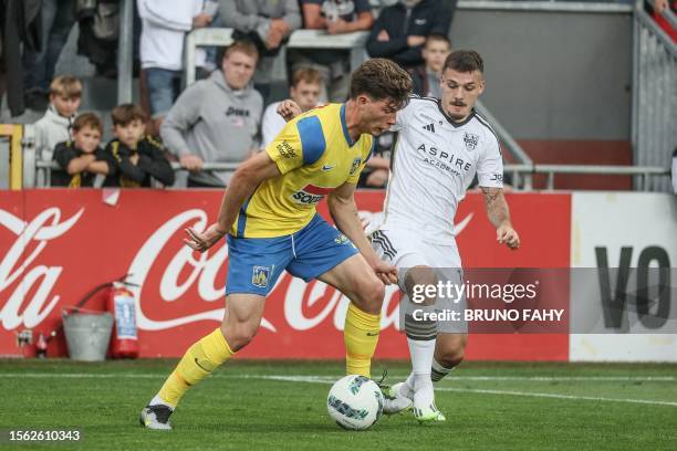 Westerlo's Jordan Bos and Eupen's Gary Magnee fight for the ball during a soccer match between KAS Eupen and KVC Westerlo, Saturday 29 July 2023 in...