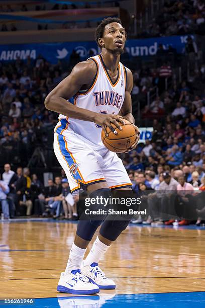 Hasheem Thabeet of the Oklahoma City Thunder shoots a free throw against the Toronto Raptors during the NBA basketball game on November 6, 2012 at...