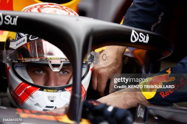 Red Bull Racing's Dutch driver Max Verstappen sits in his car in the pits prior to the sprint race ahead of the Formula One Belgian Grand Prix at the...