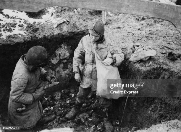 Two boys with a cache of potatoes they have found during the man-made Holodomor famine in the Ukraine, former Soviet Union, Spring 1934. The food had...