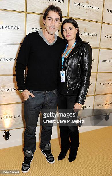 Footballer Robert Pires and wife Jessica Lemarie attend the Moet & Chandon VIP Suite during day eight of the ATP World Finals at the O2 Arena on...