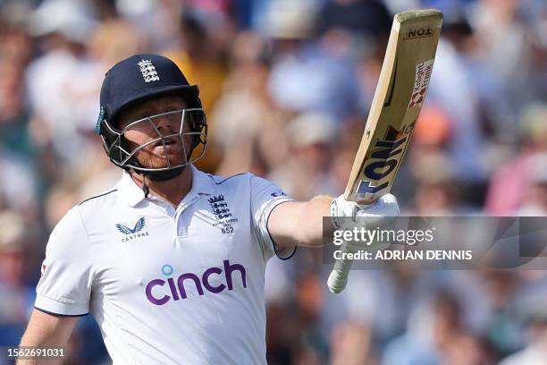 England's Jonny Bairstow celebrates reaching his half century on day three of the fifth Ashes cricket Test match between England and Australia at The...