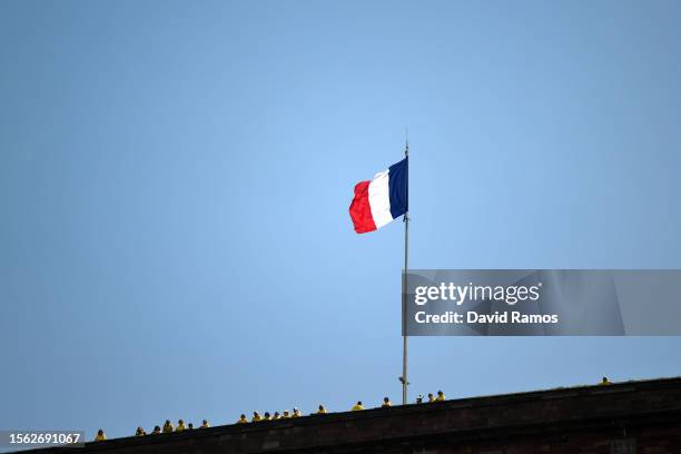 French flag waves prior to the stage twenty of the 110th Tour de France 2023 a 133.5km stage from Belfort to Le Markstein 1192m / #UCIWT / on July...