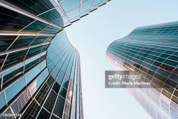 looking up view of futuristic building - city below stock pictures, royalty-free photos & images