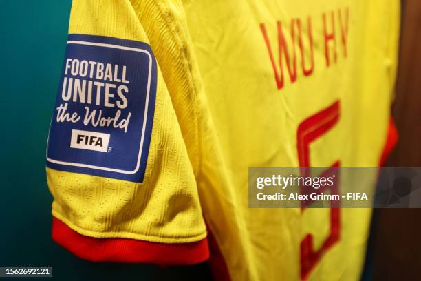 The FIFA Football Unites the World logo is seen on Wu Haiyan of China PR's shirt in the dressing room prior to the FIFA Women's World Cup Australia &...