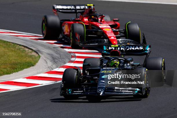 Lewis Hamilton of Great Britain driving the Mercedes AMG Petronas F1 Team W14 leads Carlos Sainz of Spain driving the Ferrari SF-23 during final...