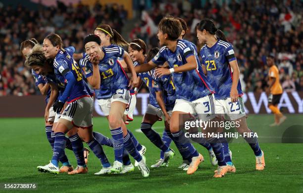 Mina Tanaka of Japan celebrates with teammates after scoring her team's first goal before disallowed due to offside during the FIFA Women's World Cup...