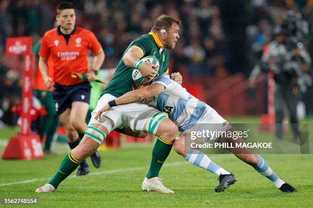 South Africa's number eight Duane Vermeulen runs with the ball as he is tackled by Argentina's wing Mateo Carreras during the Rugby Championship...