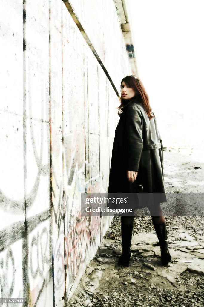 Young Woman Posing Outside Grunge Building