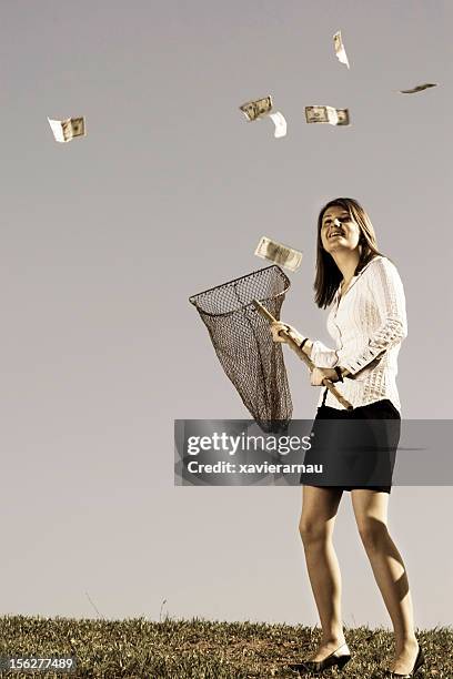 raining money - catching money stock pictures, royalty-free photos & images