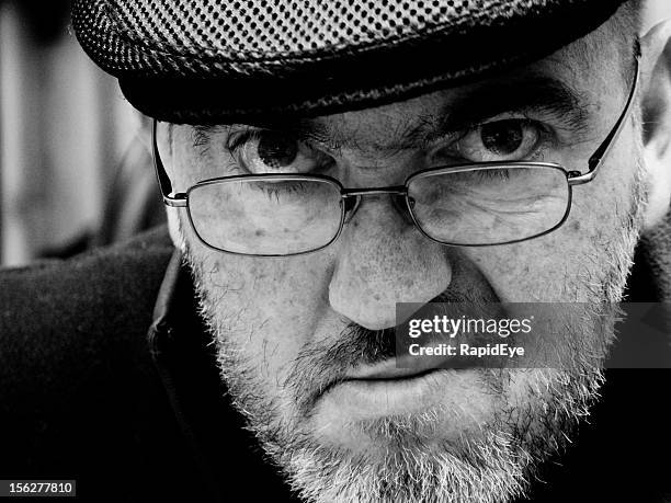 grumpy man - grumpy old man stock pictures, royalty-free photos & images