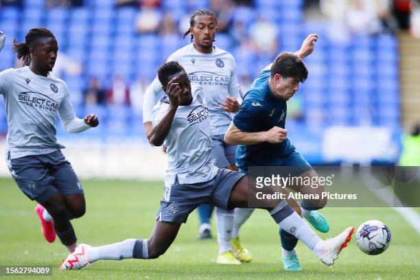 Josh Key of Swansea City tackled by Andy Yiadom of Reading during the pre-season friendly match between Reading and Swansea City at the Select Car...