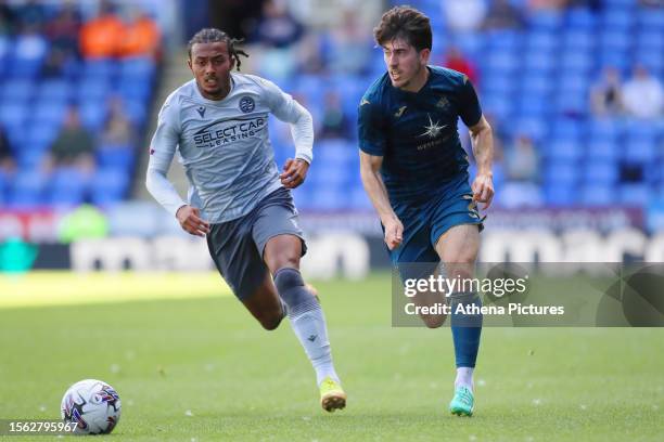 Femi Azeez of Reading and Josh Key of Swansea City in action during the pre-season friendly match between Reading and Swansea City at the Select Car...