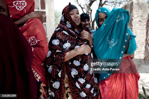 shy girls covering their faces. - hargeisa stock pictures, royalty-free photos & images