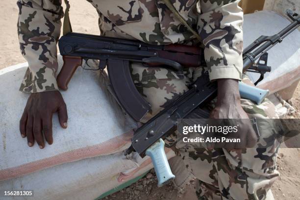 armed policeman in front at the prison.. - somalia stock pictures, royalty-free photos & images