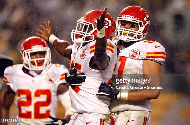 Jamaal Charles of the Kansas City Chiefs celebrates with Dexter McCluster and Tony Moeaki after Charles scored a 12-yard rushing touchdown in the...