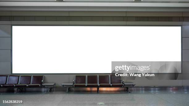blank billboard in the waiting hall - leuchtkasten stock-fotos und bilder