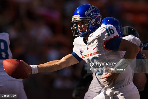 Joe Southwick of the Boise State Broncos hands the ball off during a NCAA college football game against the Hawaii Warriors on November 10, 2012 at...