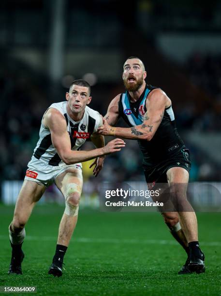 Darcy Cameron of the Magpies rucks against Charlie Dixon of Port Adelaide during the round 19 AFL match between Port Adelaide Power and Collingwood...