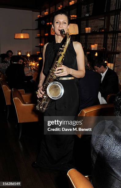 Saxophone player attends the de Grisogono private dinner at 17 Berkeley St on November 12, 2012 in London, England.