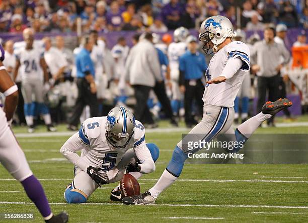 Jason Hanson of the Detroit Lions kicks a field goal with a hold from Nick Harris on November 11, 2012 at Mall of America Field at the Hubert H....
