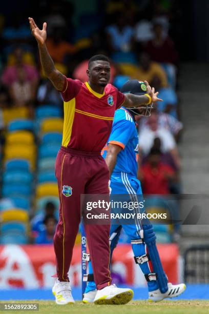 Alzarri Joseph of West Indies celebrates the dismissal of Shardul Thakur of India during the 2nd ODI cricket match between West Indies and India, at...