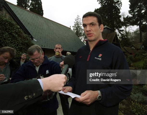 England captain Martin Johnson reads out a statement to the Press after walking out of the England Rugby Union Press Conference in which it was...