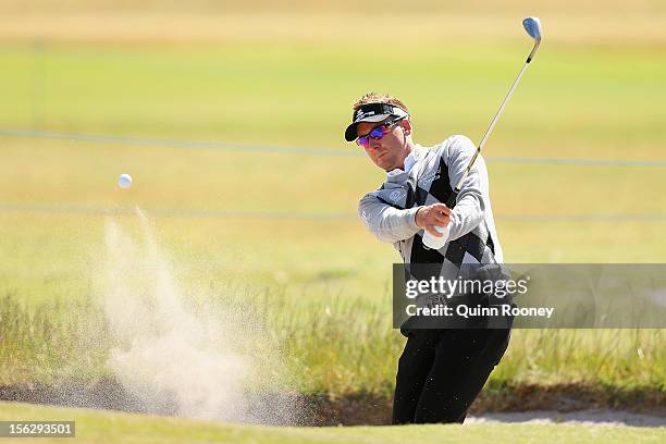 Ian Poulter of England plays out of the bunker during previews ahead of the 2012 Australian Masters at Kingston Heath Golf Club on November 13, 2012...