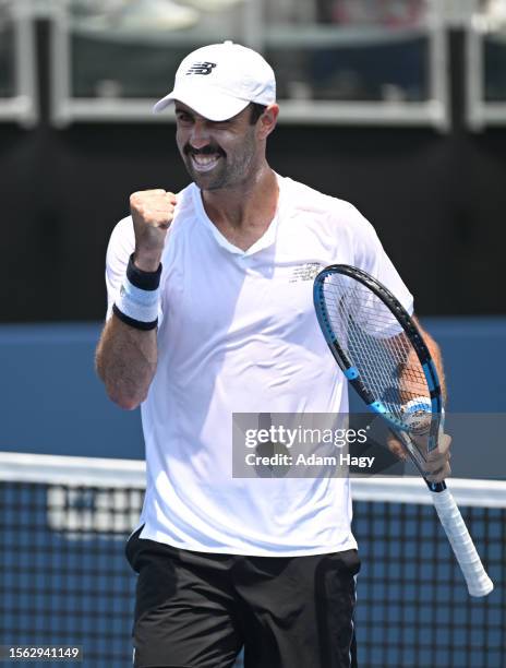 Jordan Thompson of Australia celebrates after a shot against Marcelo Melo of Brazil and John Peers of Australia during the ATP Atlanta Open...