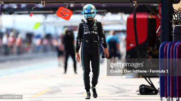 18th placed qualifier George Russell of Great Britain and Mercedes walks in the Pitlane during qualifying ahead of the F1 Grand Prix of Hungary at...