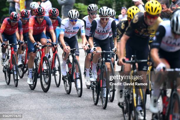 Tadej Pogacar of Slovenia - White best young jersey and Adam Yates of United Kingdom and UAE Team Emirates compete during the stage twenty of the...