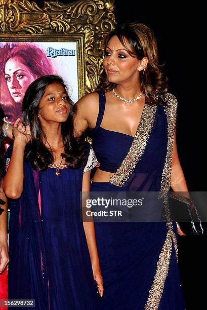 Indian Bollywood film actor Shahrukh Khan’s wife Gauri Khan and daughter Suhana pose on the red carpet at the premiere of the Hindi film 'Jab Tak Hai...