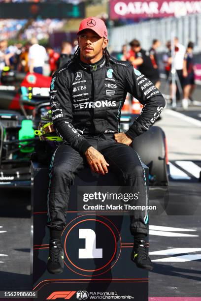 Pole position qualifier Lewis Hamilton of Great Britain and Mercedes celebrates in parc ferme during qualifying ahead of the F1 Grand Prix of Hungary...