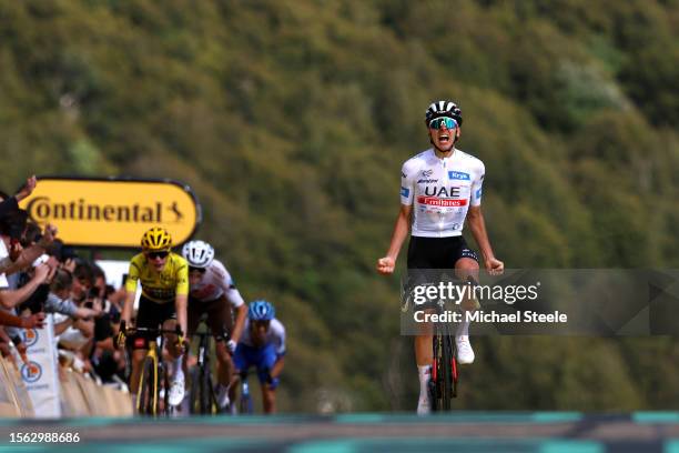 Tadej Pogacar of Slovenia and UAE Team Emirates - White best young jersey celebrates at finish line as stage winner ahead of Felix Gall of Austria...