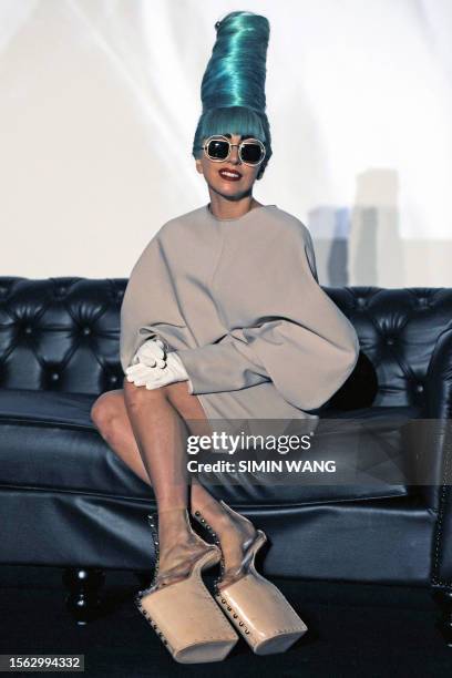Entertainment-US-Singapore-Gaga American pop star Lady Gaga poses at a promotional event in Singapore's casino complex Marina Bay Sands on July 7,...