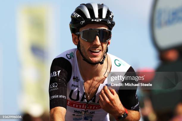 Adam Yates of United Kingdom and UAE Team Emirates celebrates at finish line his third place in the 110th Tour de France 2023 a 133.5km stage from...
