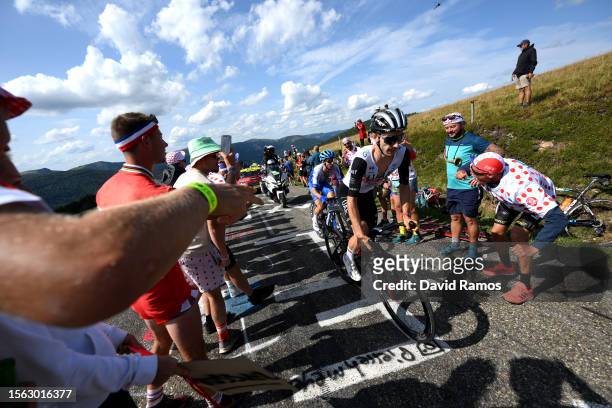 Simon Yates of United Kingdom and Team Jayco-AlUla and Adam Yates of United Kingdom and UAE Team Emirates climbing to the Le Markstein while fans...