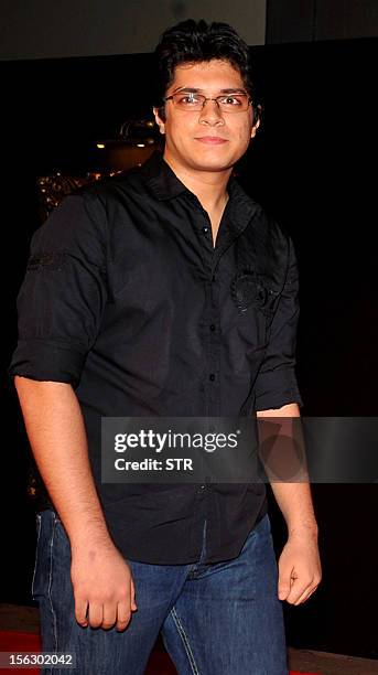 Indian Bollywood film actor Aamir Khan's son Junaid Khan poses on the red carpet at the premiere of the Hindi film 'Jab Tak Hai Jaan' in Mumbai on...