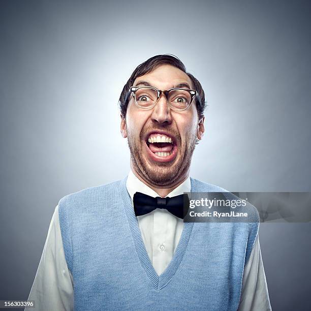studente nerd facendo una faccia buffa sorridente - gilet capo di vestiario foto e immagini stock