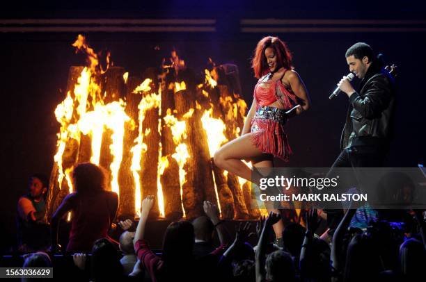 Singer Rihanna performs with Drake onstage during the GRAMMY Awards Show at the Staples Center in Los Angeles on February 13, 2011. Mick Jagger, Bob...