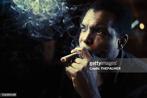 mann rauchen sie eine zigarre - cigar stock-fotos und bilder