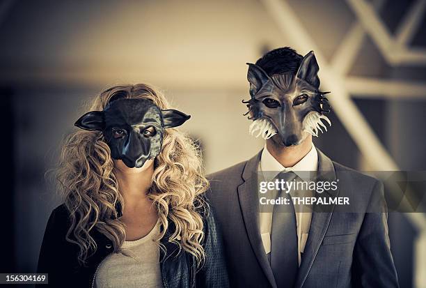 young couple wearing animal mask - wolf sheep stock pictures, royalty-free photos & images