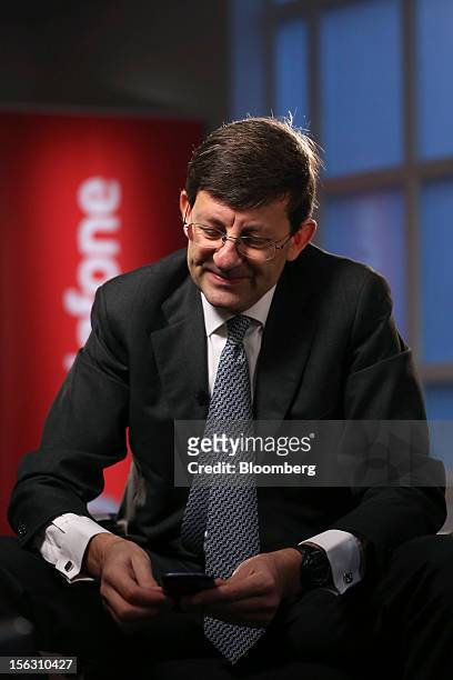 Vittorio Colao, chief executive officer of Vodafone Group Plc, looks at his mobile phone ahead of a Bloomberg Television interview in London, U.K.,...