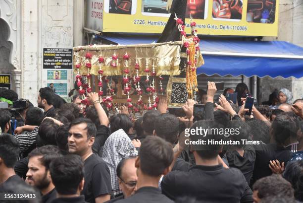Muslim devotees take part in a mourning procession marking the day of Ashura, 10 Muharram-ul-Haram, at Shia Jama Masjid Kashmiri Gate, on July 29,...