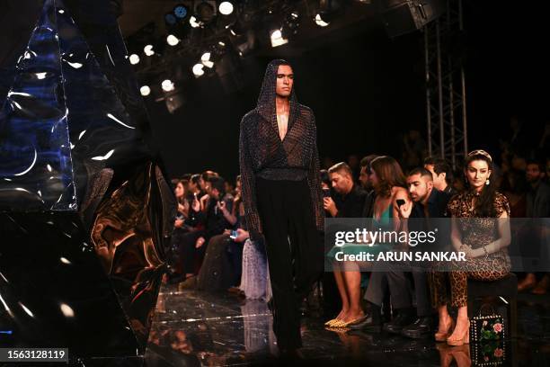 Model presents a creation by designers Rohit Gandhi and Rahul Khanna during the FDCI India Couture week in New Delhi on July 29, 2023.