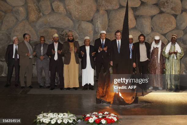 Delegation of Muslim imams from France, pray during a memorial ceremony at the Hall of Remembrance on November 13 as they visit the Yad Vashem...